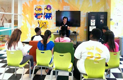 A peer mentor talks about career options with young people in Carson.